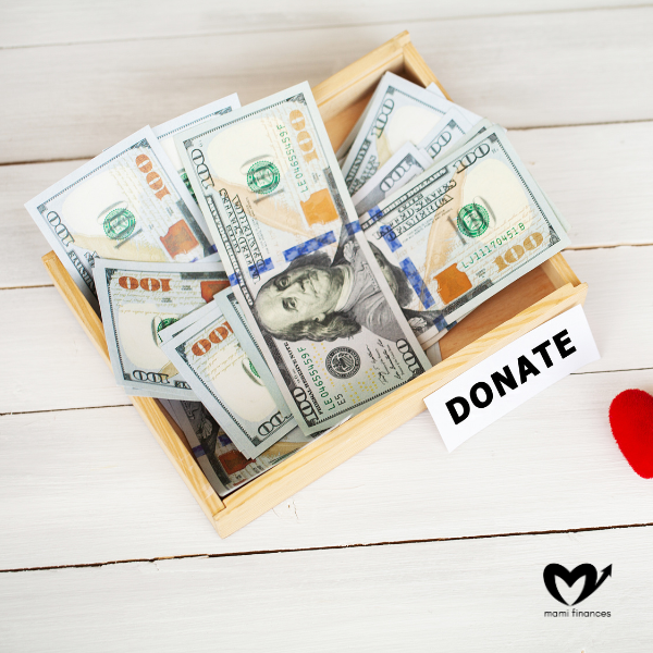 Box with Money on White Wood Background