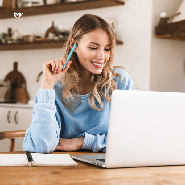 Woman Working on Laptop at Home