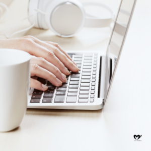 Woman working on laptop on a desk