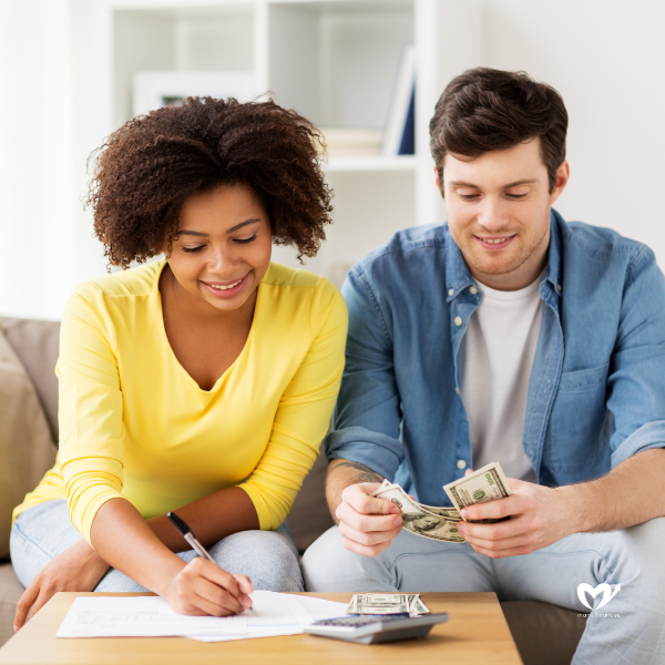 Happy Couple with Papers and Calculator